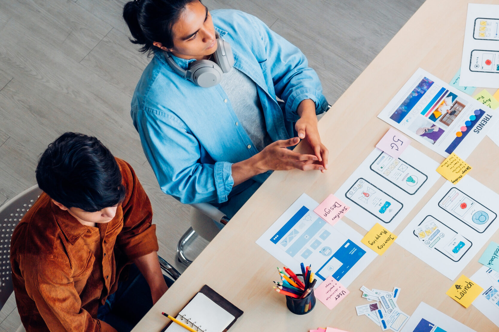 Top,View,Asian,Ux,Developer,And,Ui,Designer,Brainstorming,About